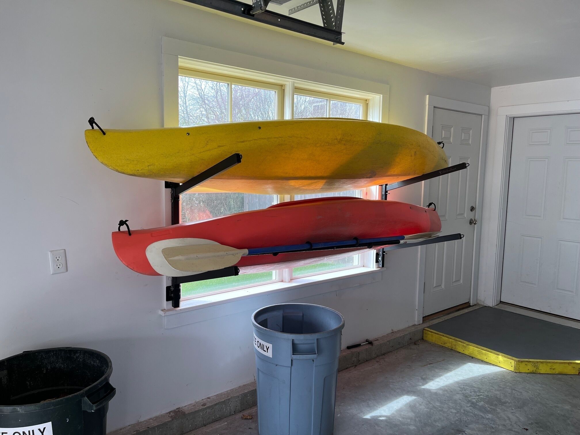 Two beginner Kayaks with paddles and life jackets. 
