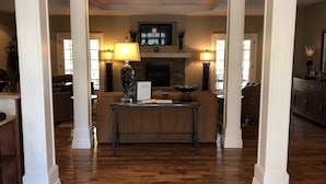 A spacious living area with a fireplace, a coffee table, and a sofa. - 5-Star Branson Hills Villa - 4 Master Suites, Sleeps Up to 10, Pool & Golf (Branson)
