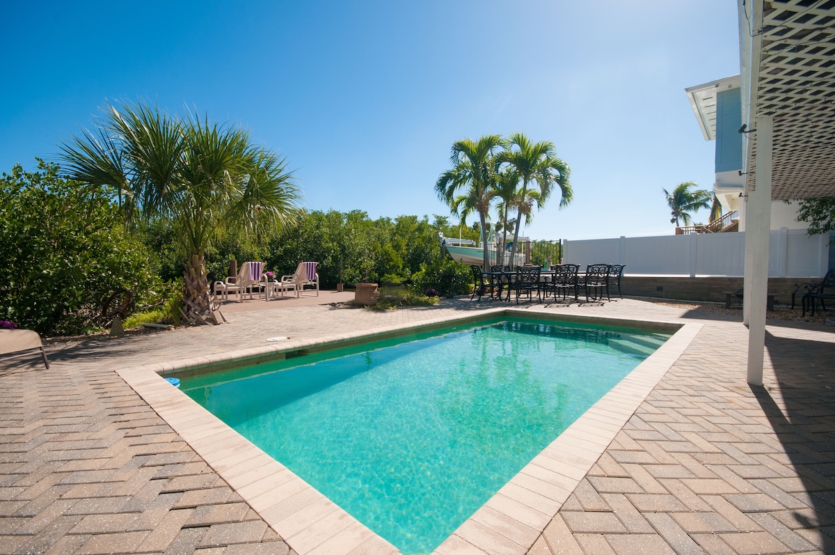 Photo 3 of 3BED 3BATH Tropical Paradise WATERFRONT POOL HOUSE On Canal 1 mile to the BEACH!