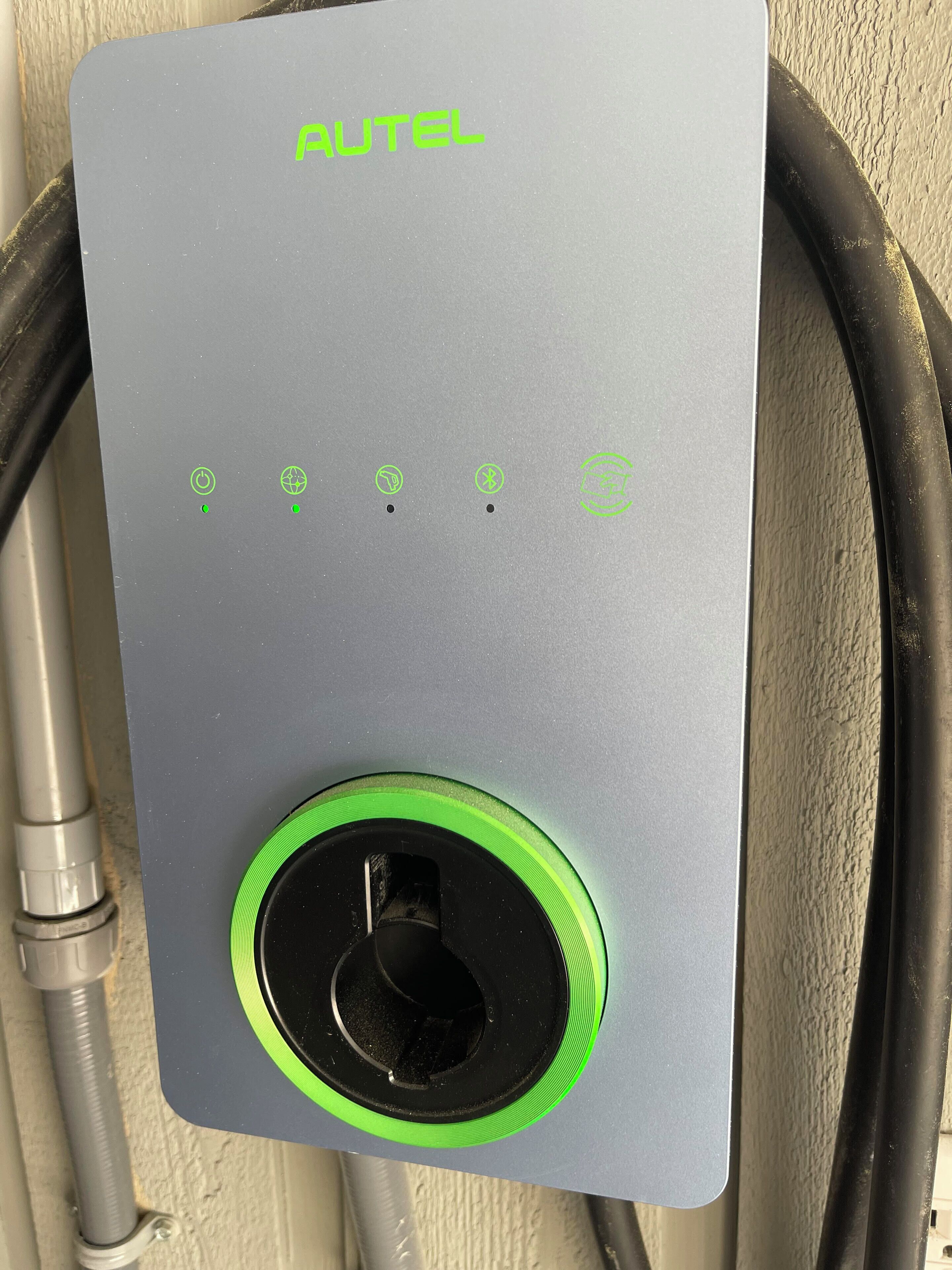 A grey control panel with the brand name "AUTEL" and a green power button.