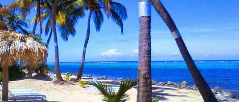 On the beach, sun loungers, beach towels