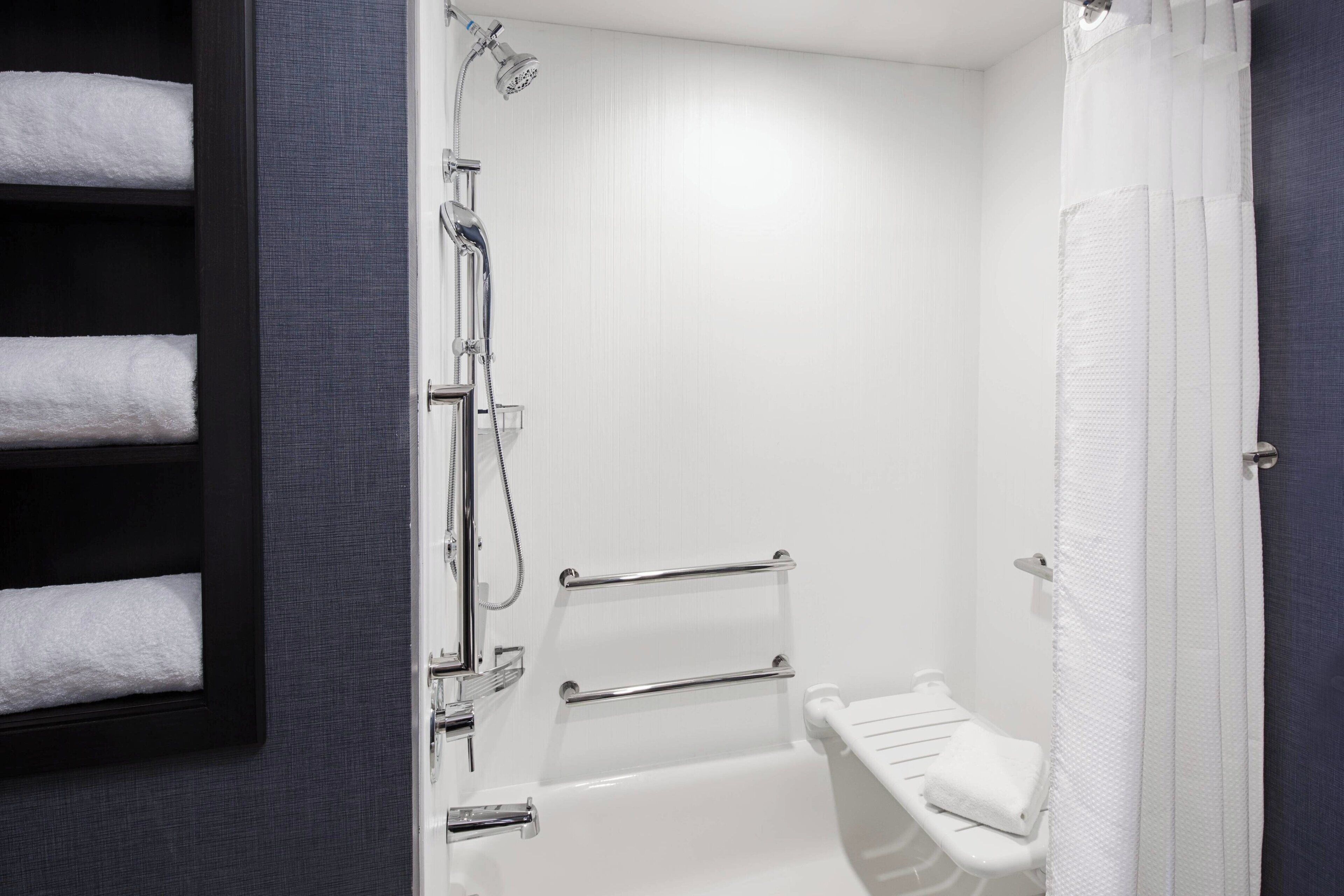 designer toiletries, hair dryer, towels, soap