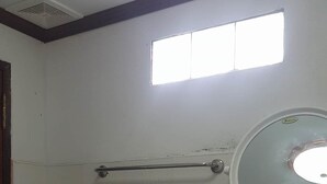 A bathroom with a white sink, a mirror, and a towel rack. - Pings Farmstay (Somboon)