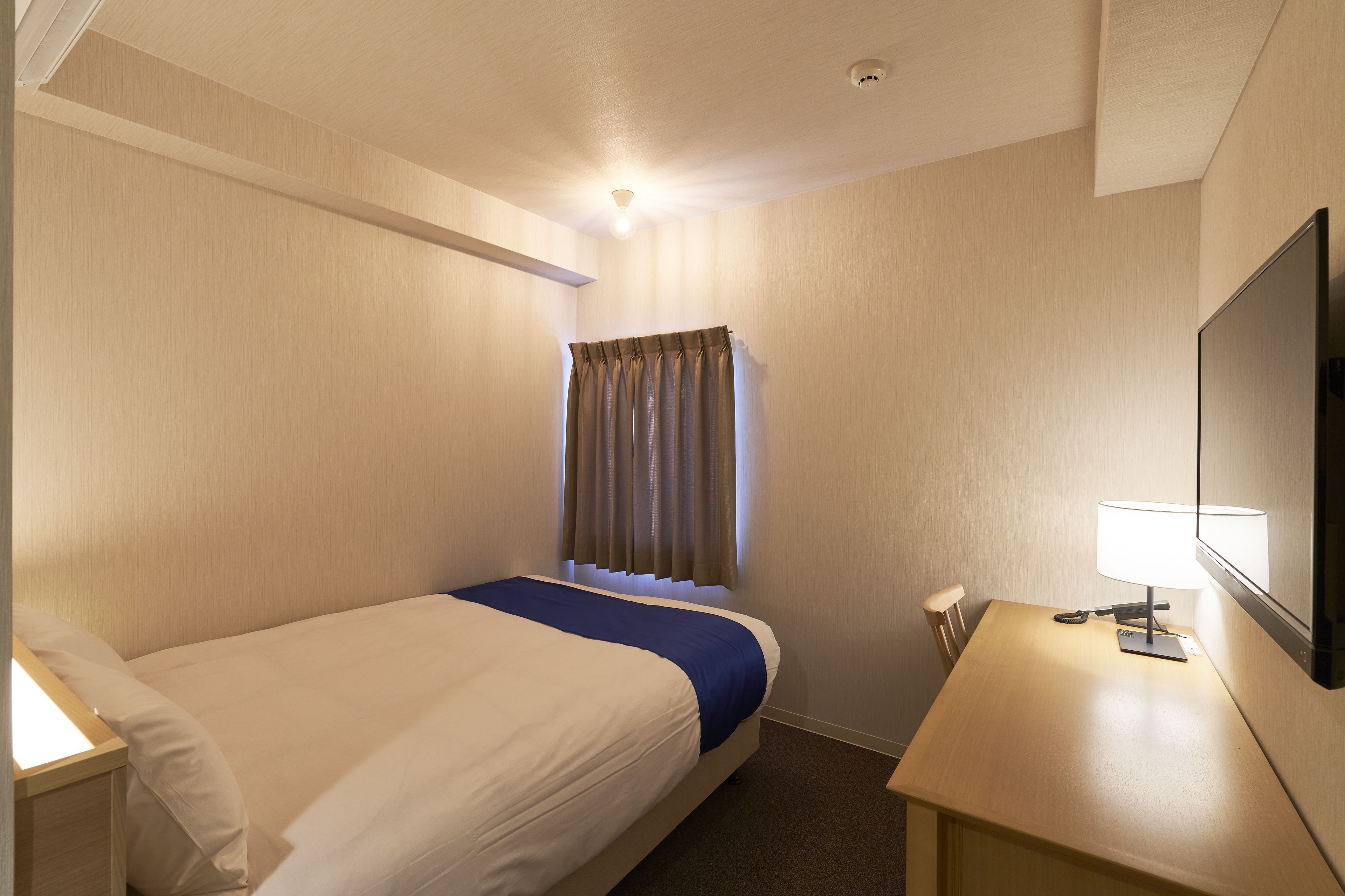 single room | in-room safe, blackout curtains, iron/ironing board, free wifi