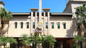 A building with a central sign for 'Spring' and 'Chinatown Motel'.