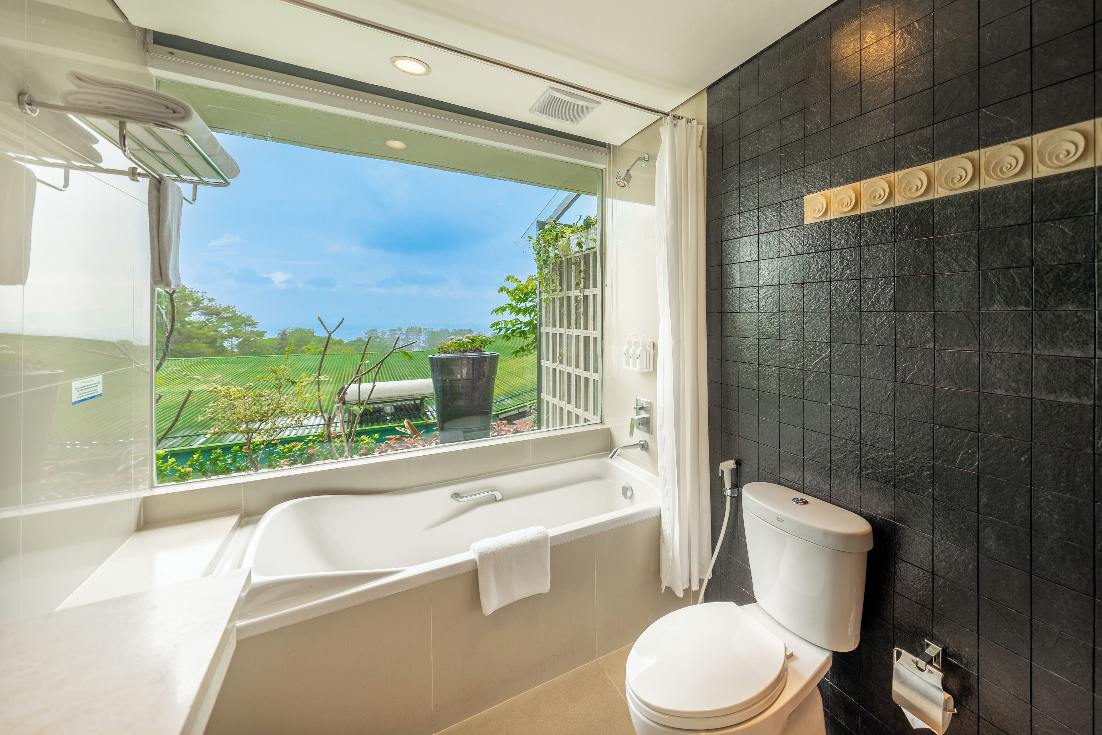 deluxe room, balcony | bathroom | free toiletries, hair dryer, slippers, towels