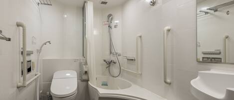 Un baño moderno con inodoro, ducha y lavabo.