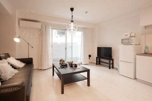 Apartamento | Área de estar | TV de tela plana