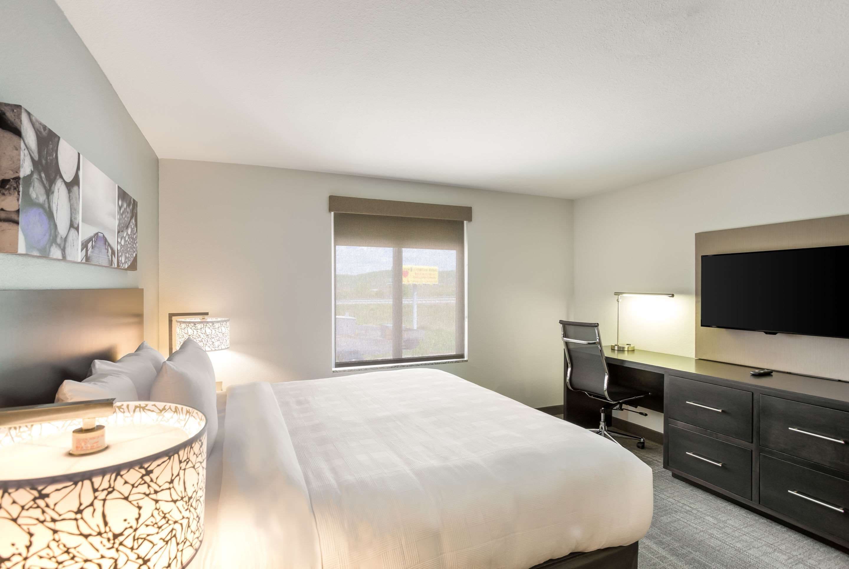 suite, 1 king bed, non smoking | premium bedding, desk, laptop workspace, blackout curtains