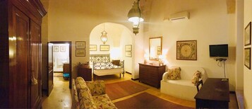 Superior Quadruple Room | Minibar, in-room safe, desk, iron/ironing board