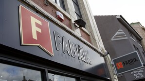 A building with a prominent 'Fabrik' sign, indicating a property or mortgage advice center. - Winter Gardens Service Apartments 2 (Blackpool)