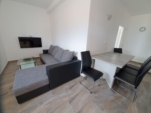 A0. Ground floor 2 bedroom apartment | Living area | 80-cm flat-screen TV with satellite channels, TV - Apartments Ljubic (Pag)