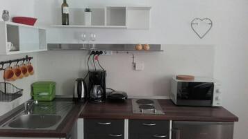 Apartment, 1 Bedroom | Private kitchenette | Fridge, microwave, stovetop, coffee/tea maker