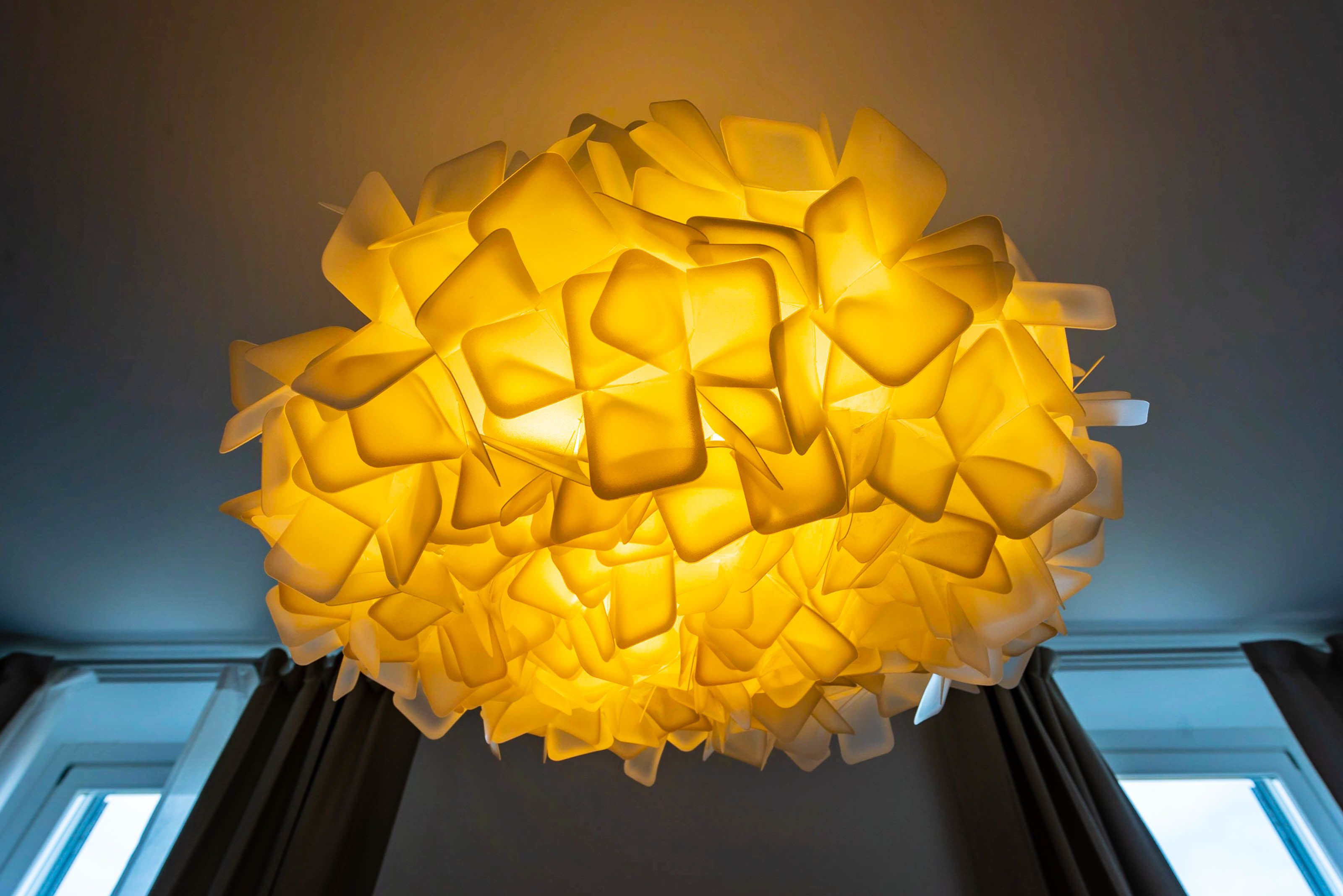 A spherical chandelier with a geometric design.