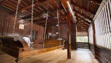 Luxury Villa, 1 King Bed, Garden View | Living area | Flat-screen TV, fireplace