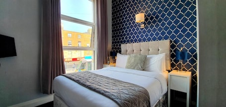 Premium bedding, desk, laptop workspace, iron/ironing board. The Gate Hotel