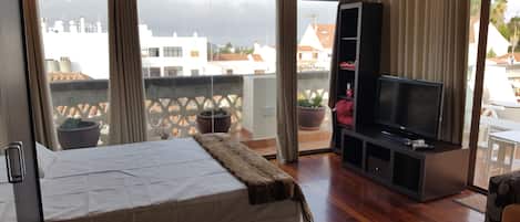 1 bedroom, desk, iron/ironing board, travel crib