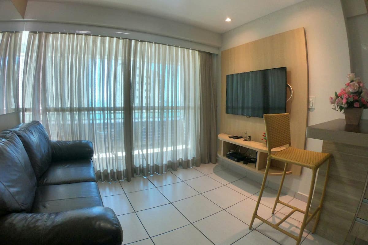 Luxury Apartment | Living area | Flat-screen TV