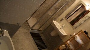 A bathroom with a shower, sink, and a towel rack. - Casa Mia - NO Reception (Trento)