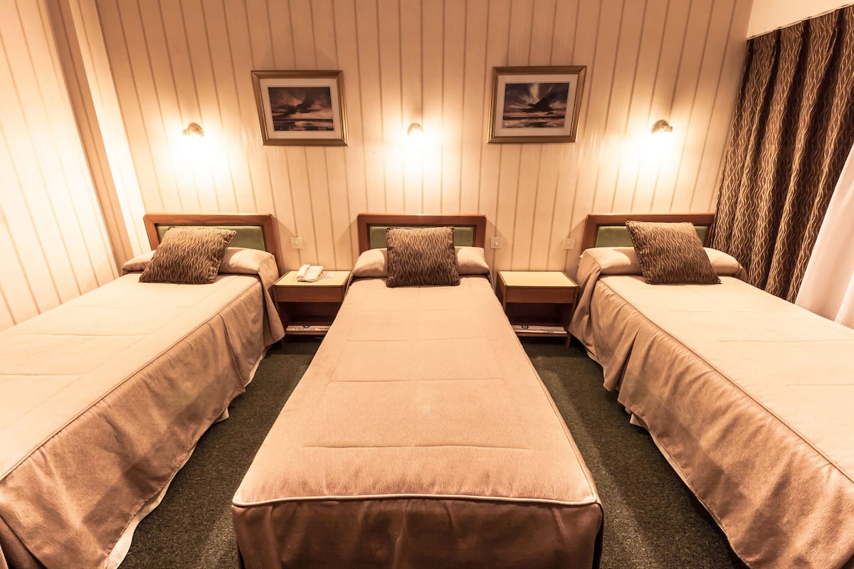 standard triple room, 3 single beds, non smoking | in-room safe, desk, blackout curtains, iron/ironing board