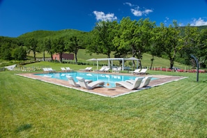 Seasonal outdoor pool, pool umbrellas, pool loungers