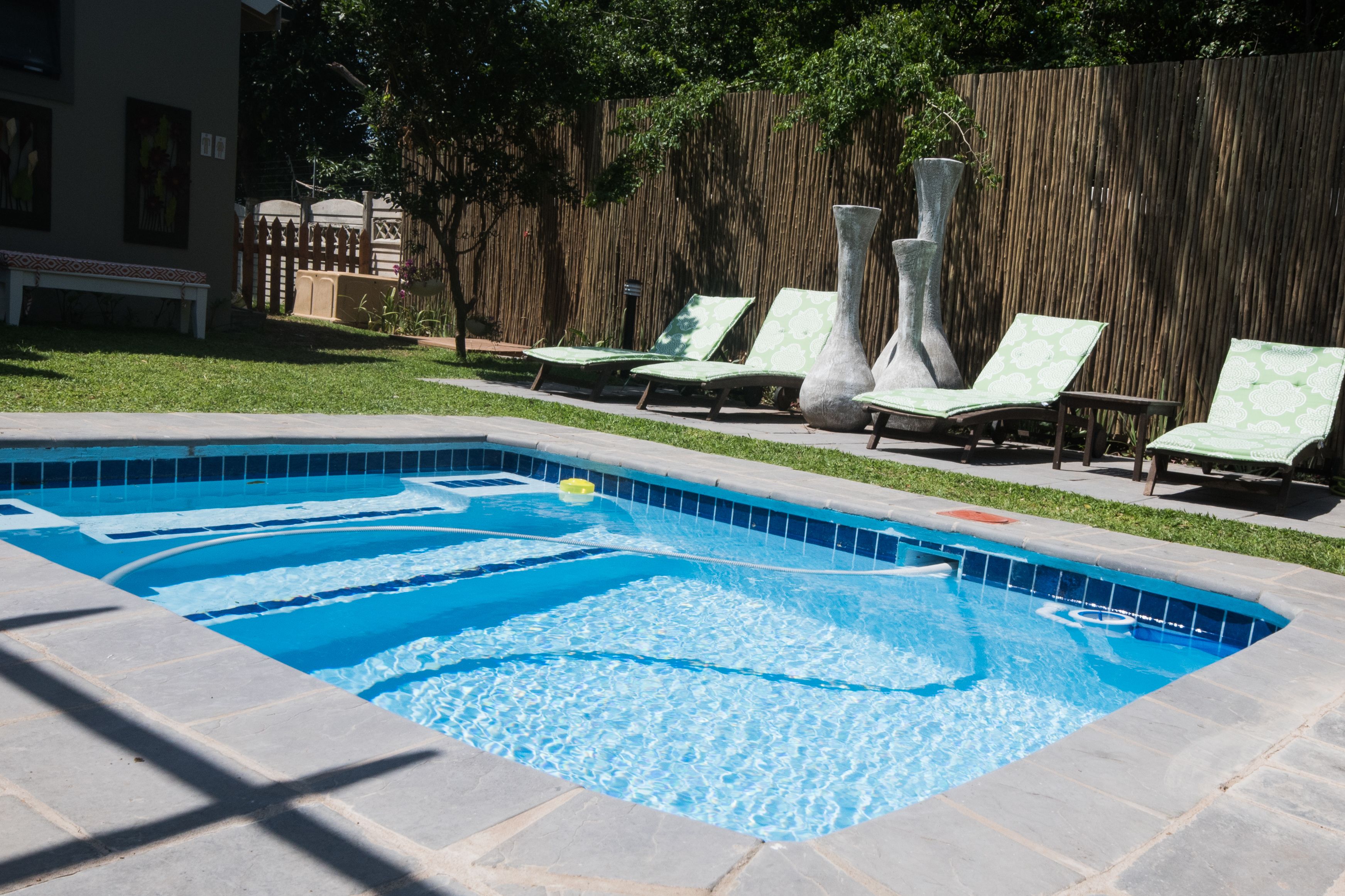 Outdoor pool, pool umbrellas, sun loungers