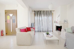 Villa | Living area | 24-inch flat-screen TV with cable channels, TV