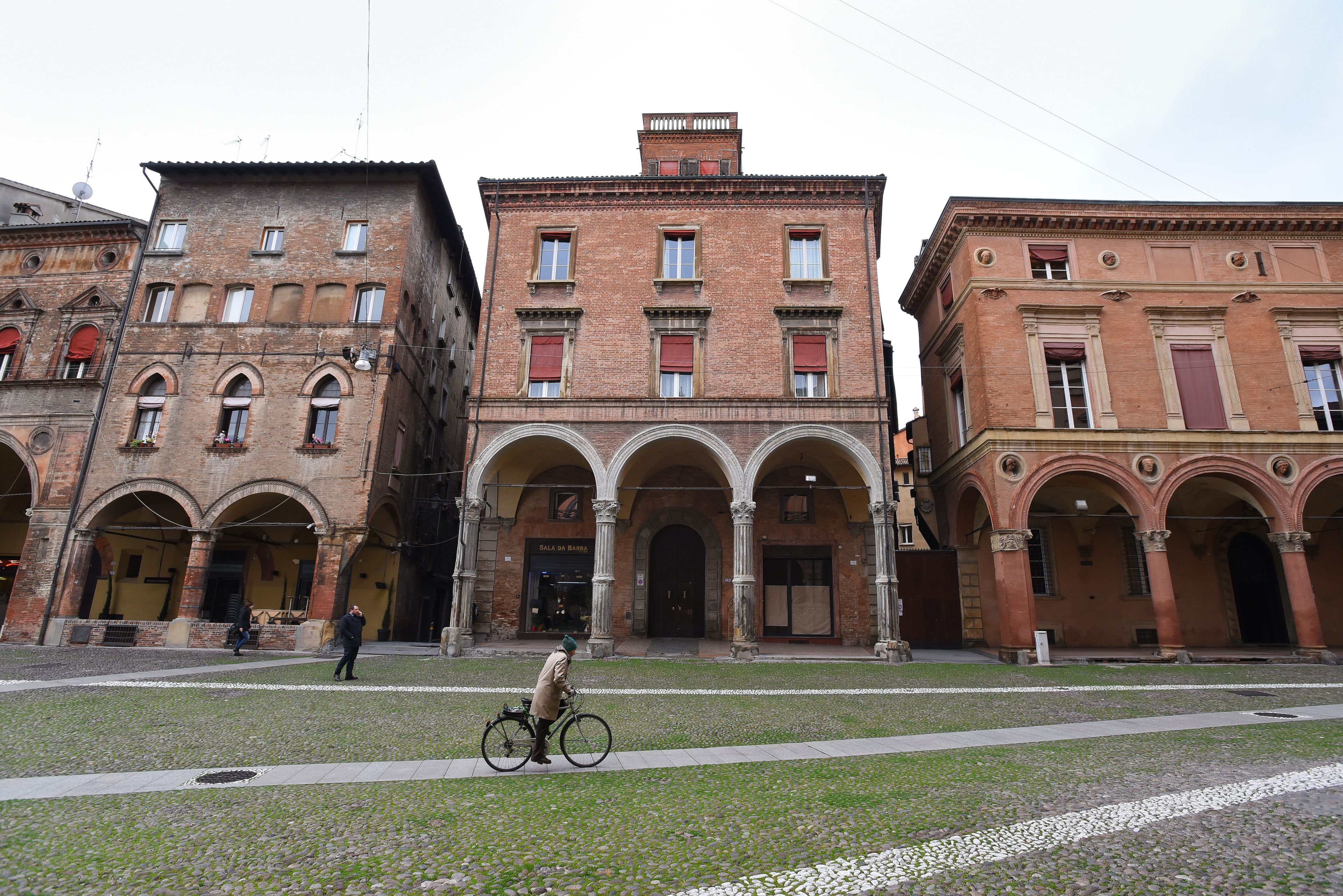 A historic building with arched windows and a central courtyard.
