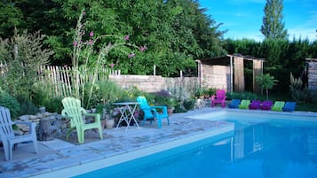 Outdoor pool, open 9:00 AM to 9:00 PM, pool umbrellas, pool loungers