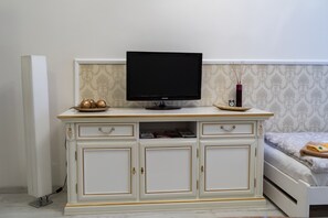 Romantic Studio, Multiple Beds, Kitchenette, Courtyard Area | Television