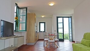 Apartment, 1 Bedroom (no.55) | Living room | Flat-screen TV - Holideal Campione Bed & Surf (Tremosine)