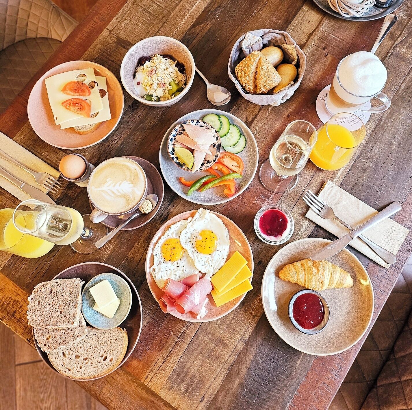 A breakfast buffet with various food items and beverages.