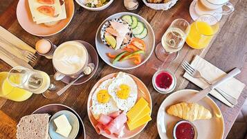 A breakfast buffet with various food items and beverages.