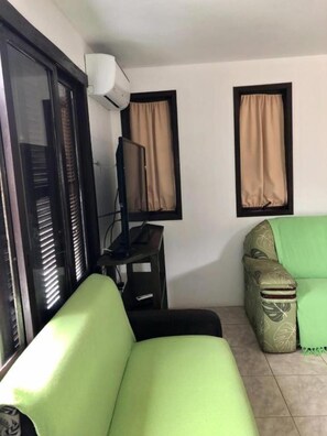 Apartment, Jetted Tub | Living room - Pousada Beira Mar (Garopaba)