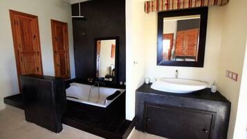 Combined shower/bathtub, hair dryer, towels, toilet paper