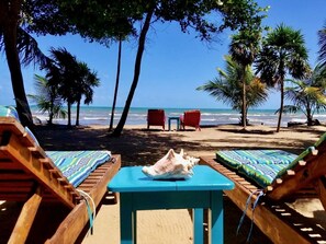 On the beach, sun-loungers, beach towels