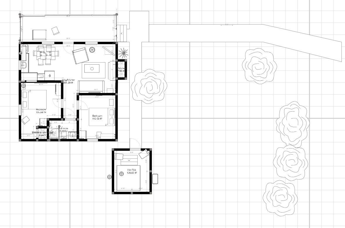 Plano de planta de un hotel que incluye un dormitorio principal, baño, cocina, comedor y un pequeño balcón.