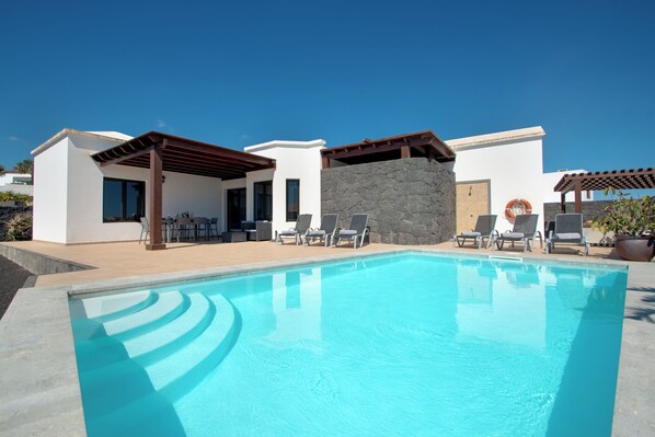 A heated pool, pool umbrellas