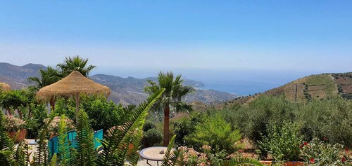 Stylish Andalusian country house with pool in olive grove facing the sea