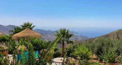 Stylish Andalusian country house with pool in olive grove facing the sea