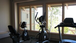 A home gym with a treadmill, stationary bike, and elliptical machine. - Mountain Condo For All Season Fun And Relaxation/ Family Friendly 2Bath2Bedrooms (Steamboat Springs)