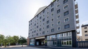 A multi-story hotel with a modern design, featuring a prominent 'HOTEL' sign at the top. - B&B Hotel Roma Fiumicino Aeroporto Fiera 1 (Fiumicino)