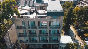 A multi-story building with balconies, large windows, and a sign that reads "LAZI". - Hotel Lazi (Kobuleti)