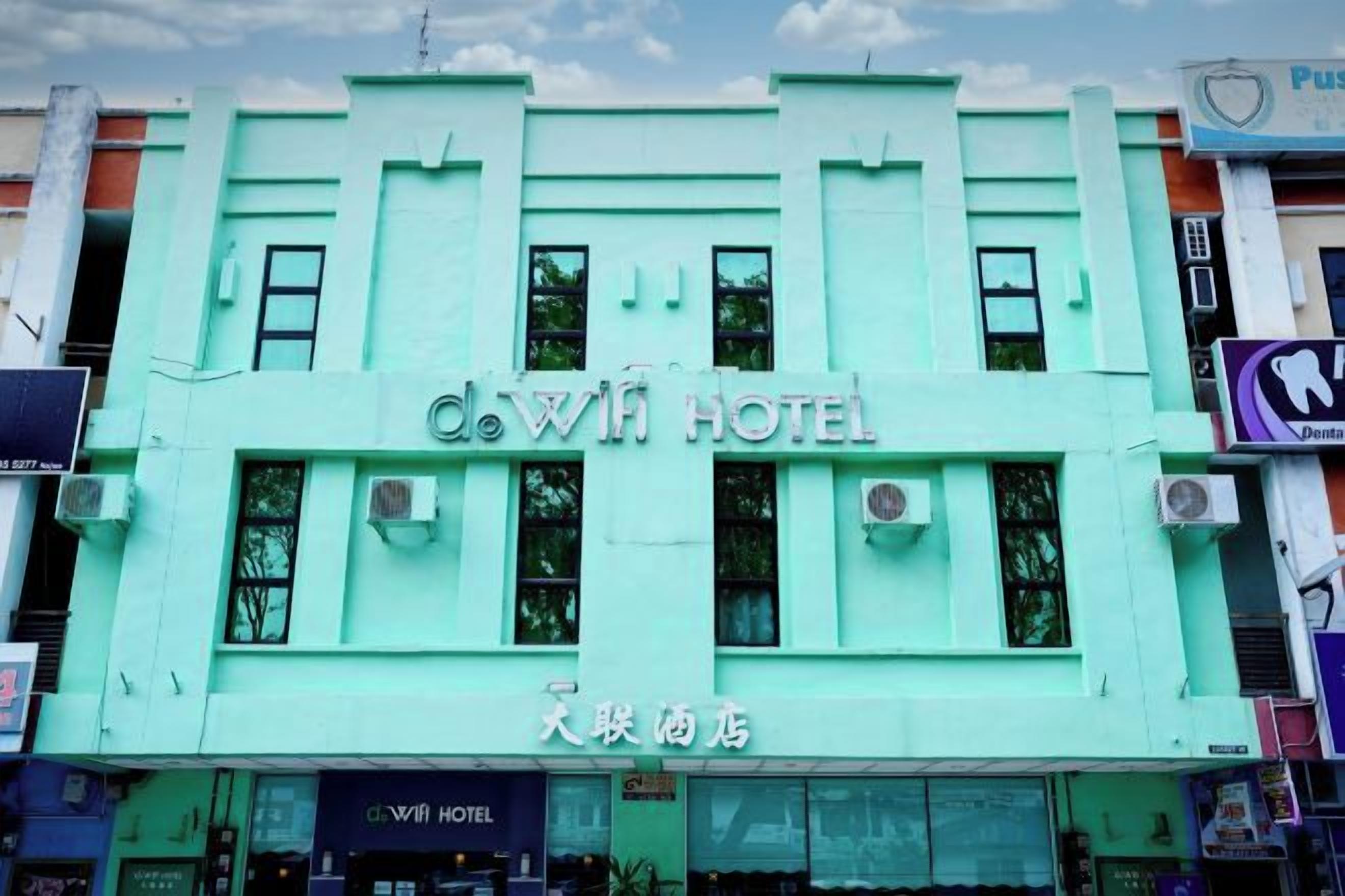 A building with a sign that reads 'Dowin Hotel' and another sign with Chinese characters.