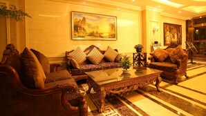 A luxurious lobby with ornate furniture, a large painting on the wall, and a well-lit ceiling. - Jiali Holiday Inn Wanhe Branch (Chengdu)