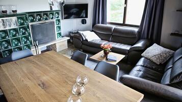 Comfort House, 2 Bedrooms, Non Smoking, Garden View | Living area | 65-inch flat-screen TV with cable channels, TV, fireplace