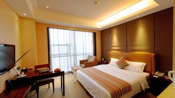 Standard Double Room | Minibar, in-room safe, desk, blackout drapes
