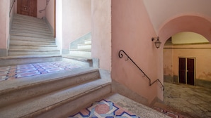 A staircase with patterned tiles leading to a door. - Corte's House (Sorrento)
