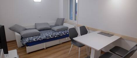 City Apartment, 1 Bedroom | Living area | 52-cm flat-screen TV with cable channels, LCD TV