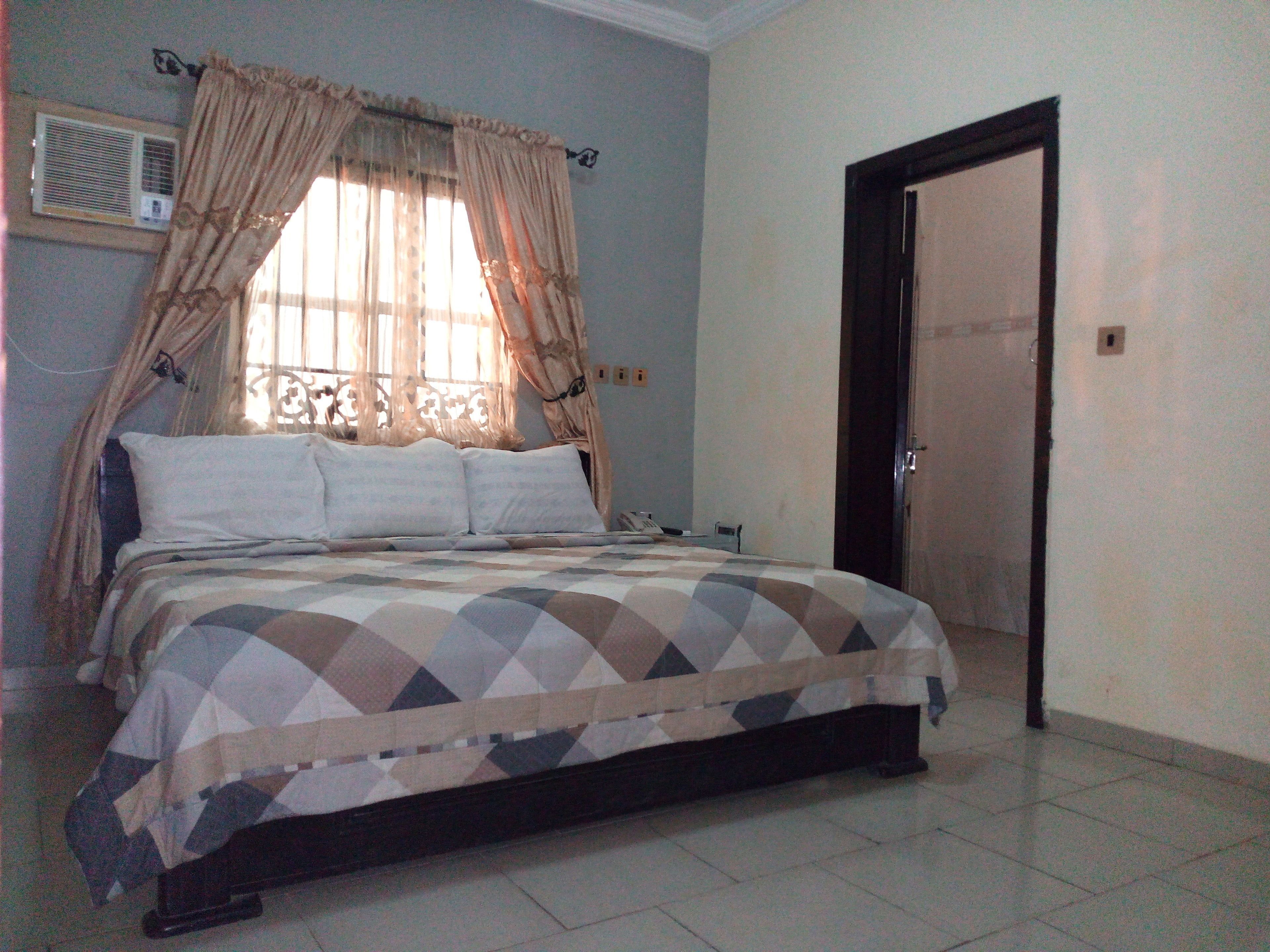 Minibar, desk, blackout curtains, iron/ironing board